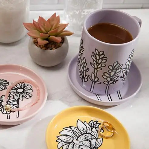 A Ceramic Lavender Mug showcasing a calming lavender design, placed on a light-colored surface.