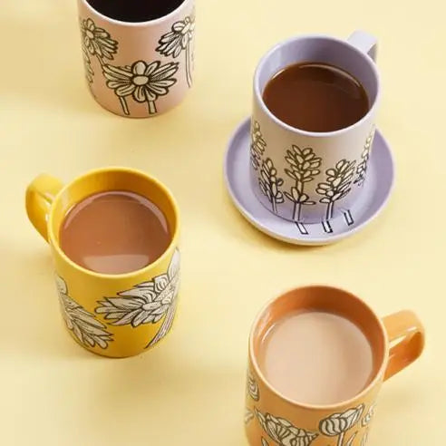 A Ceramic Lavender Mug showcasing a calming lavender design, placed on a light-colored surface.