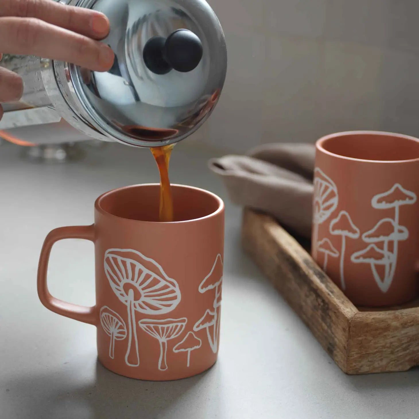 Ceramic Mushroom Mug with a whimsical mushroom pattern.
