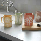 Ceramic Mushroom Mug with a whimsical mushroom pattern.