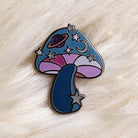 Cosmic Mushroom Enamel Pin, with a creative blend of mushroom and cosmic design, symbolizing the connection between nature and the universe.