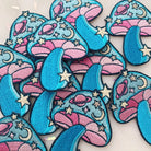Cosmic Mushroom Patch, blending a detailed mushroom design with a mesmerizing cosmic backdrop, symbolizing the fusion of nature and the universe.