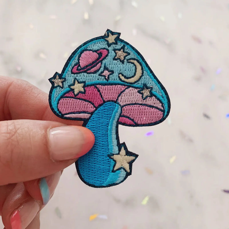 Cosmic Mushroom Patch, blending a detailed mushroom design with a mesmerizing cosmic backdrop, symbolizing the fusion of nature and the universe.