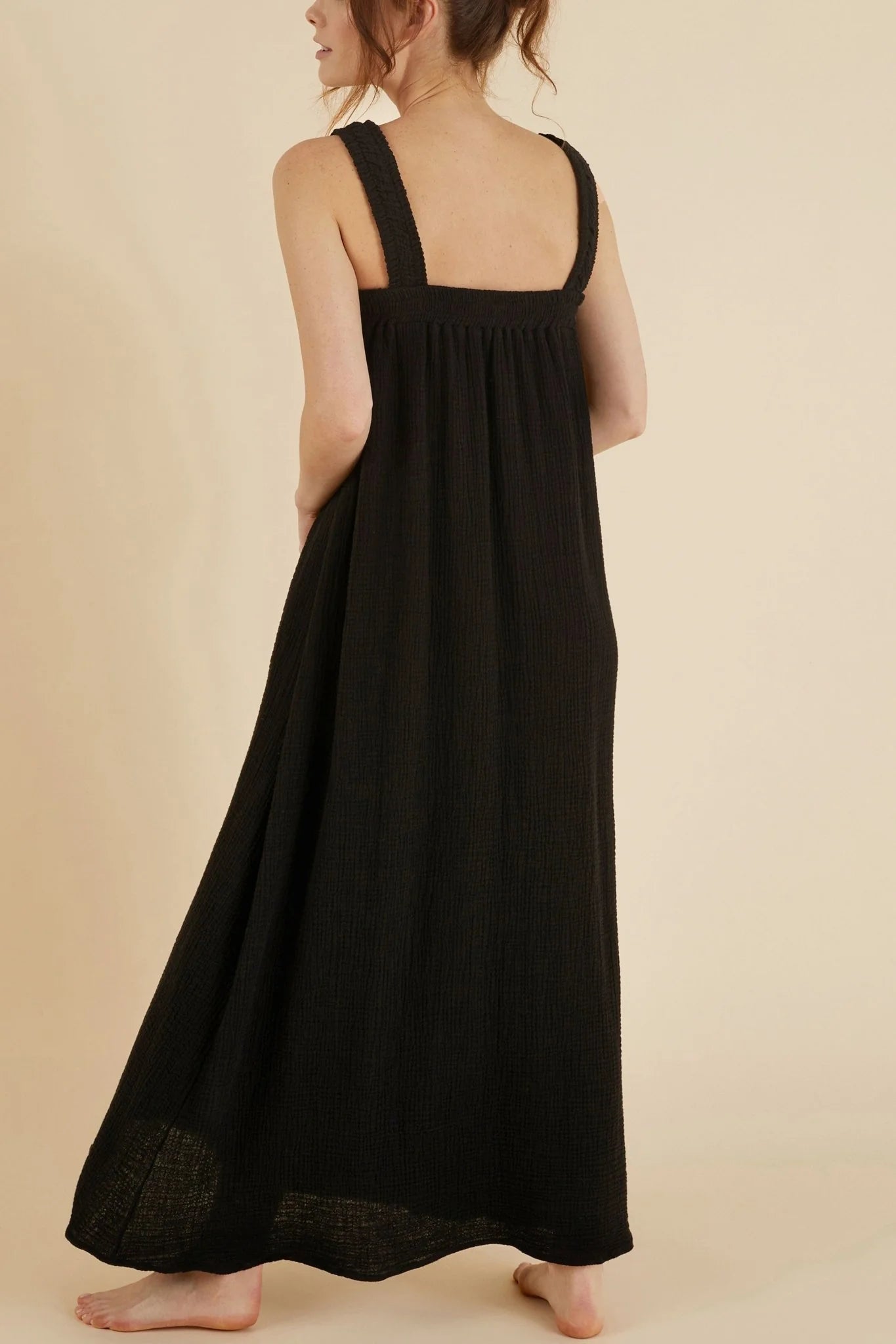 The Noa Straps Maxi Dress, made from 100% Turkish cotton, elegantly displayed, showcasing its delicate straps and flowing maxi length.