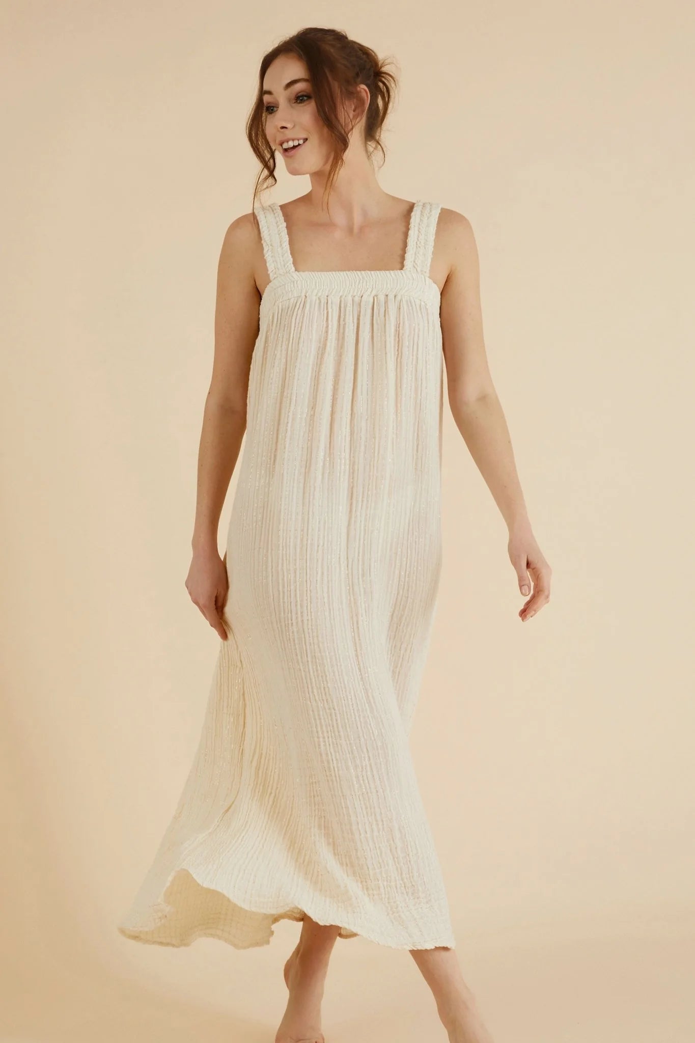 The Noa Straps Maxi Dress, made from 100% Turkish cotton, elegantly displayed, showcasing its delicate straps and flowing maxi length.