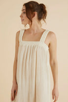 The Noa Straps Maxi Dress, made from 100% Turkish cotton, elegantly displayed, showcasing its delicate straps and flowing maxi length.