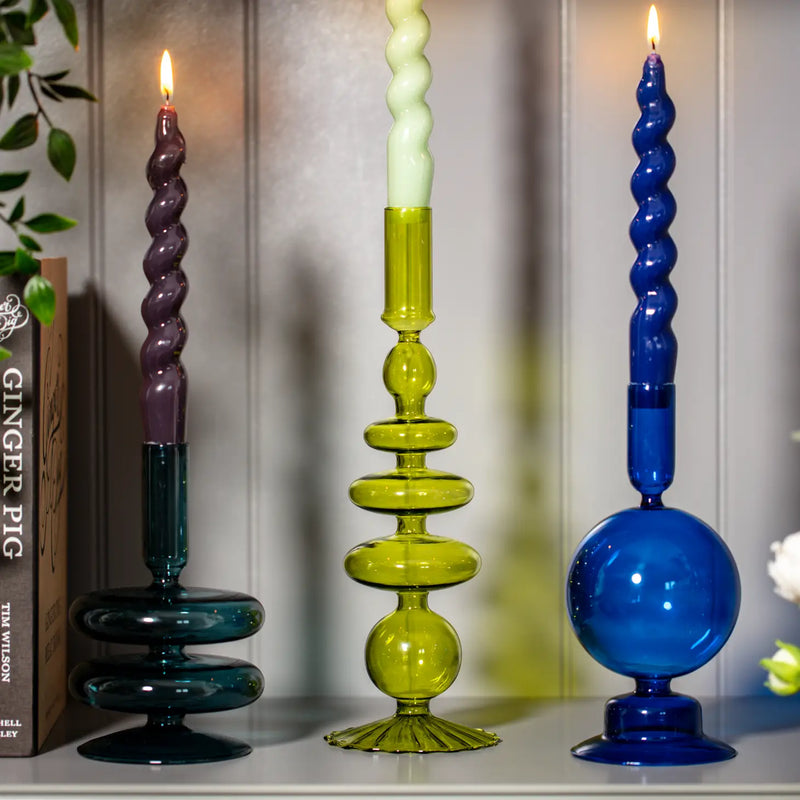 Ocean Teal Coloured Glass Taper Holder, reflecting a calming, sea-inspired glow.