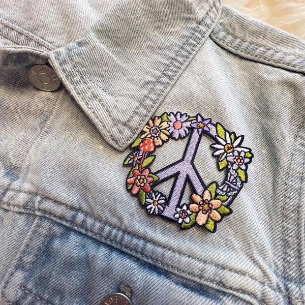 Floral Peace Sign Patch, showcasing a detailed peace symbol adorned with vibrant blossoms, symbolizing unity and nature's splendor.