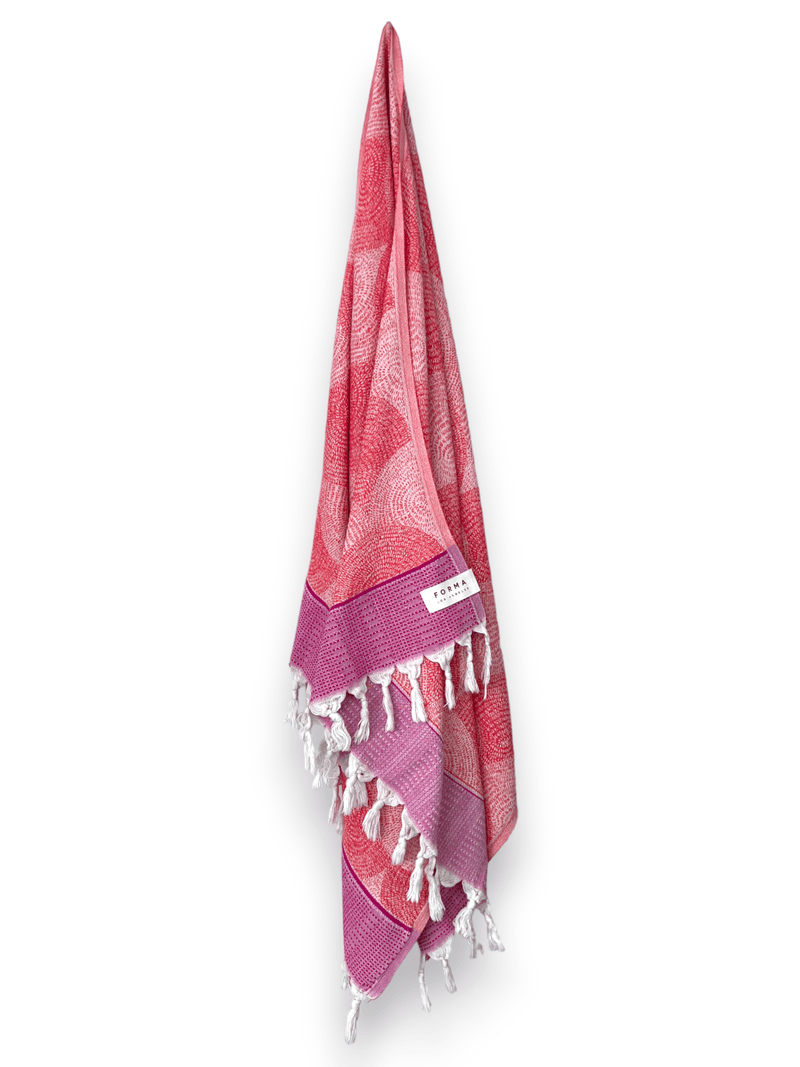 A set of Forma Towels from the Shell Collection, highlighting their soft, absorbent texture, ideal for both beach and home use.