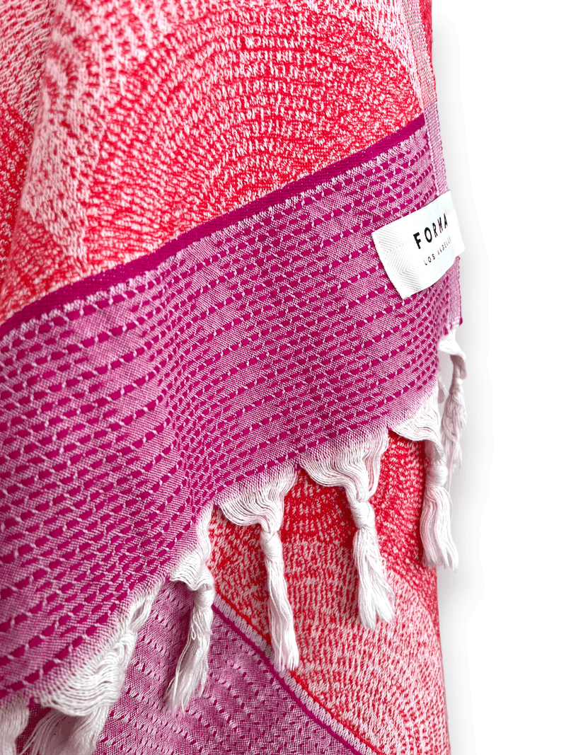 A set of Forma Towels from the Shell Collection, highlighting their soft, absorbent texture, ideal for both beach and home use.