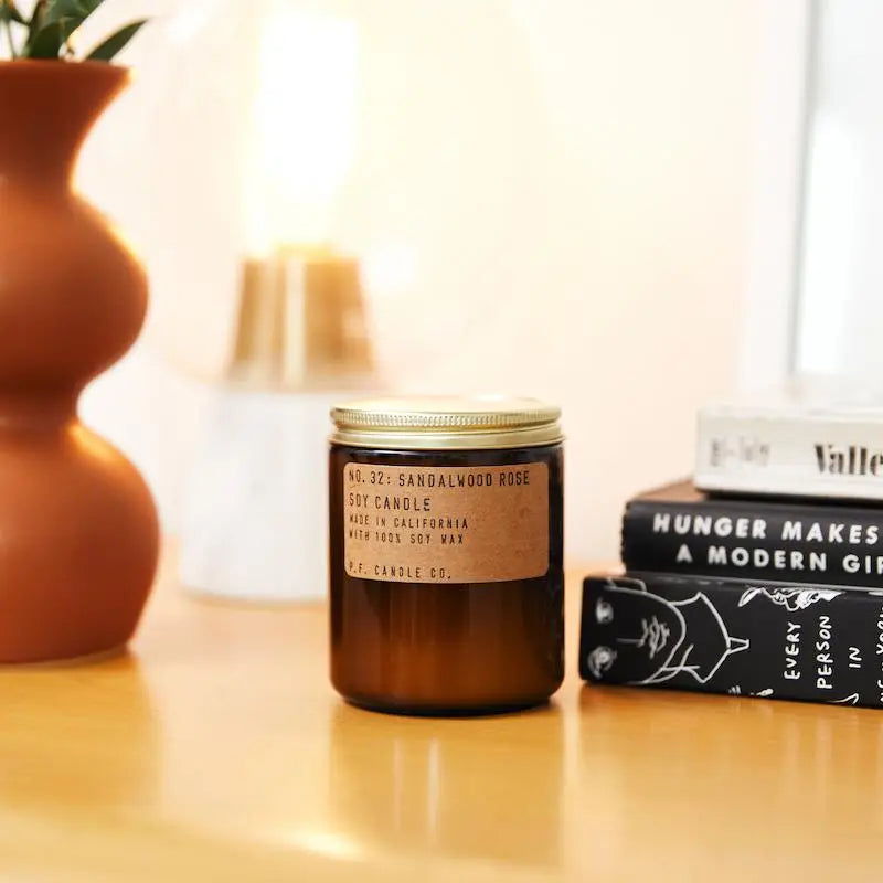 Sandalwood Rose Soy Candle in sustainable packaging, releasing a calming blend of sandalwood and rose fragrances.