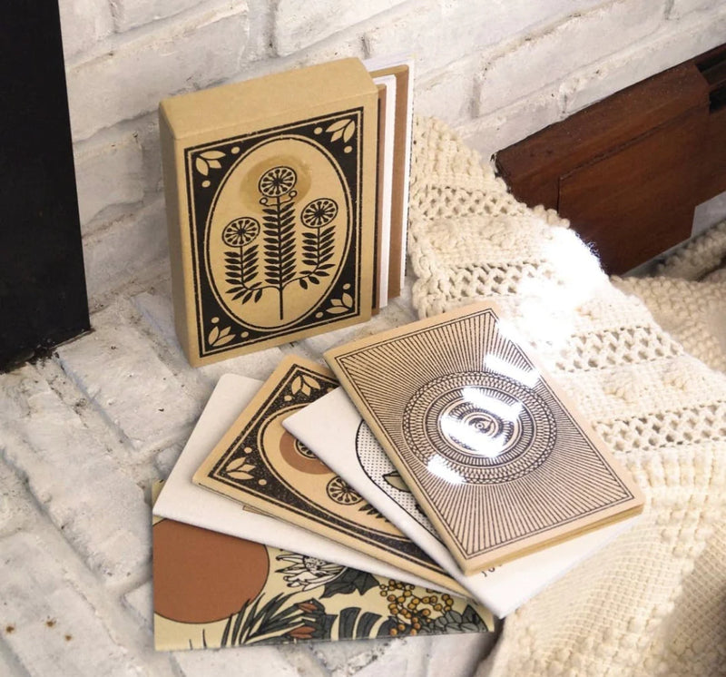 A set of five Skinny Notebooks in various colours, showcasing their slim design and portability.