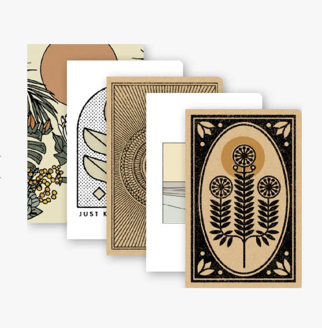 A set of five Skinny Notebooks in various colours, showcasing their slim design and portability.