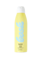 Person holding a Bask SPF 30 Sunscreen Spray against a sunny beach 