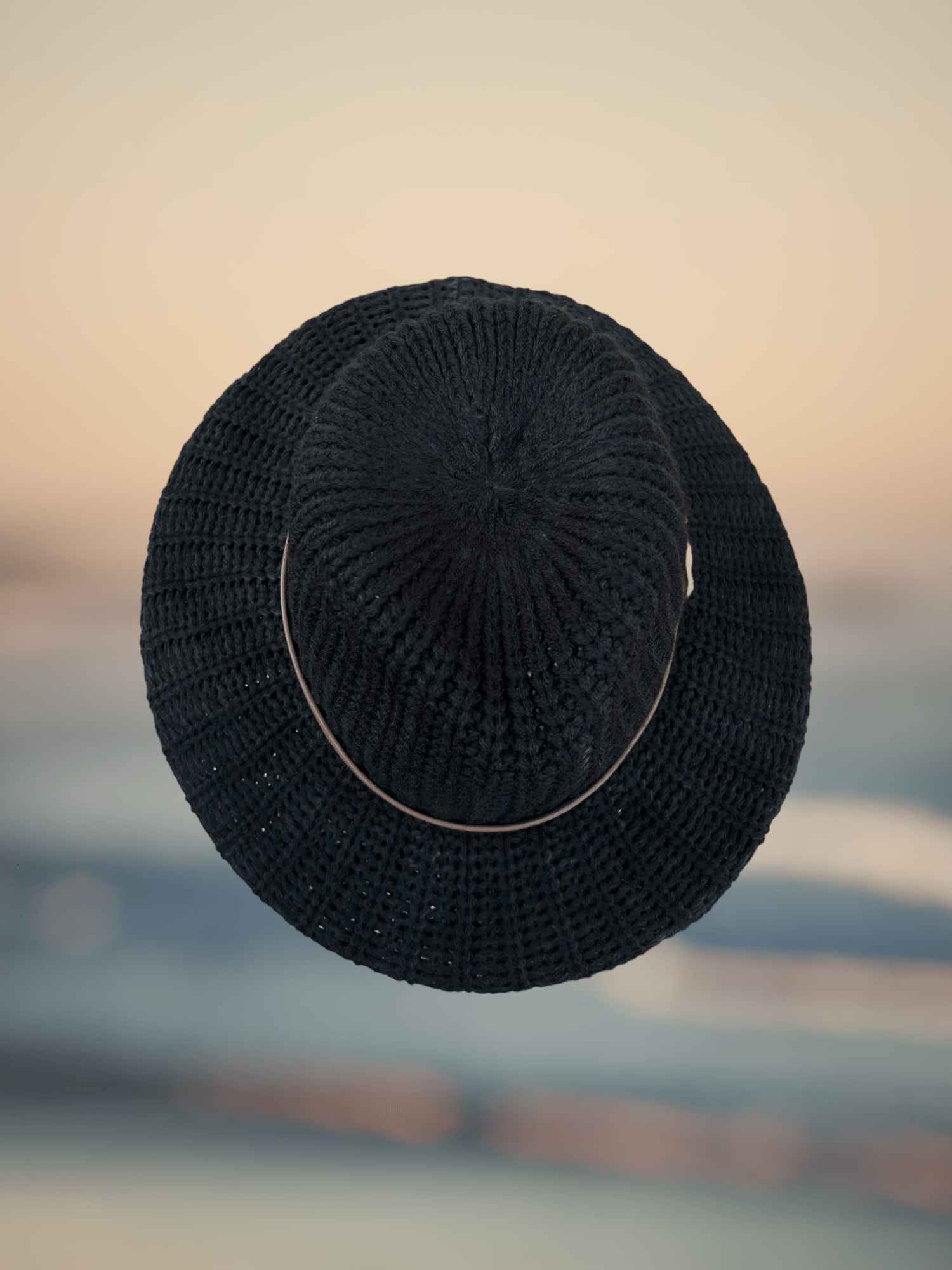 Warm Knit Hat showcasing finely crafted knit patterns, a cozy addition to your winter wardrobe.