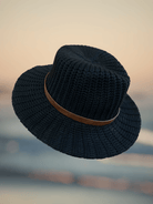 Warm Knit Hat showcasing finely crafted knit patterns, a cozy addition to your winter wardrobe.