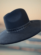 Stylish Mesa Hat, offering a sophisticated silhouette to complement any ensemble with grace.