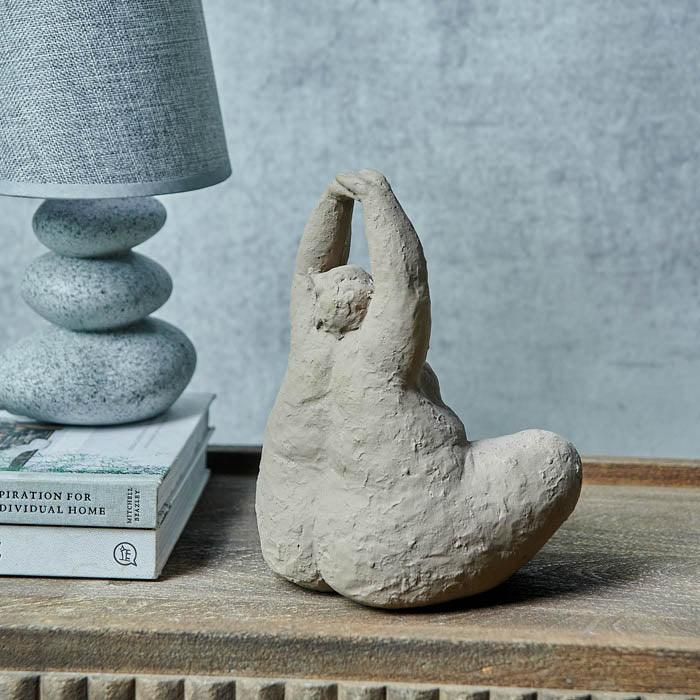 Clay Yoga Sculpture, elegantly crafted, embodying tranquility and mindfulness.