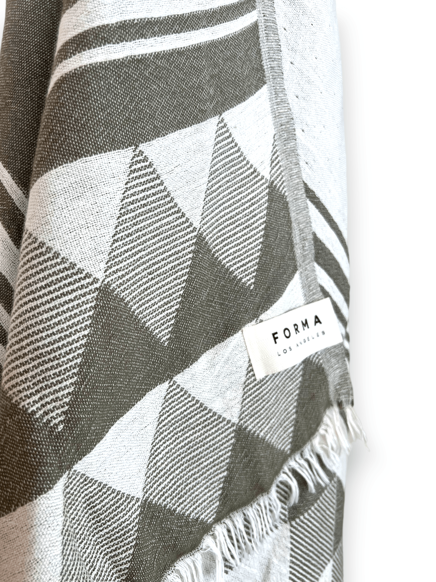 A set of Forma Towels from the Yosemite Collection, showing their soft, absorbent texture, suitable for beach or home use.