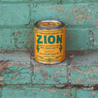 Zion Soy Candle in sustainable packaging, diffusing a striking, earthy scent reminiscent of the unique desert park.