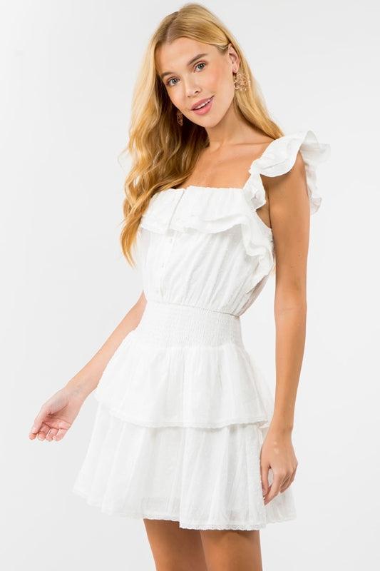 Elegant Dolly Dress displaying a delicate silhouette, evoking vintage charm and modern grace.