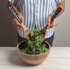 Ziggy Mango Wood Serving Utensil - Elegant serving utensils with white abstract design and mango wood handles, ideal for meal presentations.