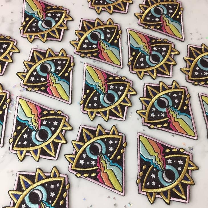 Cosmic Evil Eye Rainbow Patch, featuring a captivating blend of the evil eye symbol, cosmic design, and colorful rainbow.