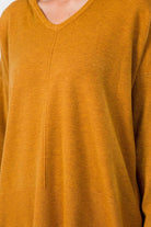Sydney Hooded Sweater showcasing its comfortable fabric blend and trendy hooded design, perfect for a cozy and stylish look.