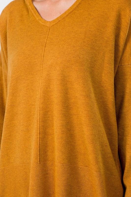 Sydney Hooded Sweater showcasing its comfortable fabric blend and trendy hooded design, perfect for a cozy and stylish look.