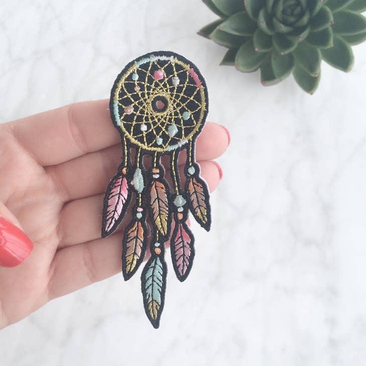 Dreamcatcher Patch, depicting a detailed woven design with hanging feathers, embodying spiritual protection and positive dreams.