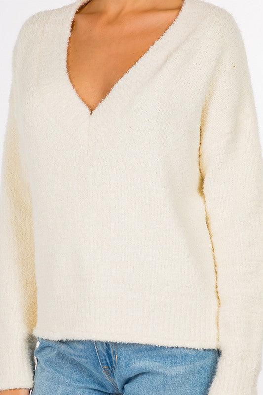 Evelyn Sweater featuring a classic design and soft, warm fabric, ideal for a comfortable and stylish outfit.