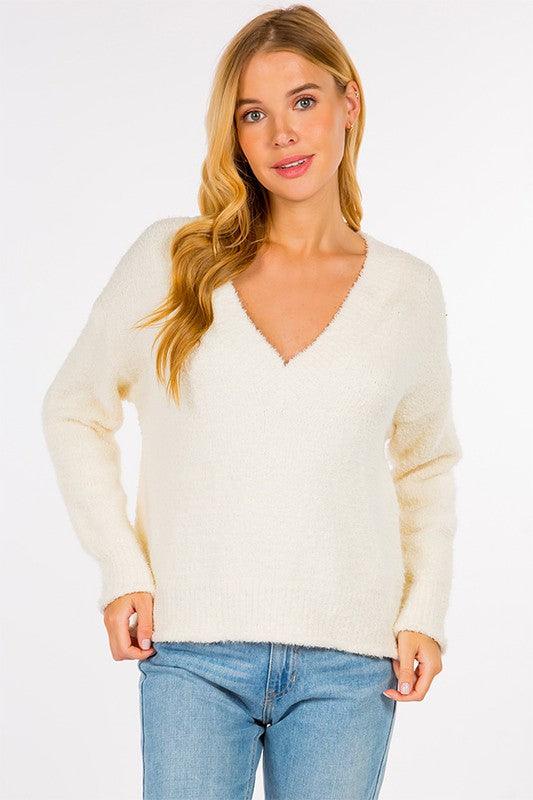 Evelyn Sweater featuring a classic design and soft, warm fabric, ideal for a comfortable and stylish outfit.