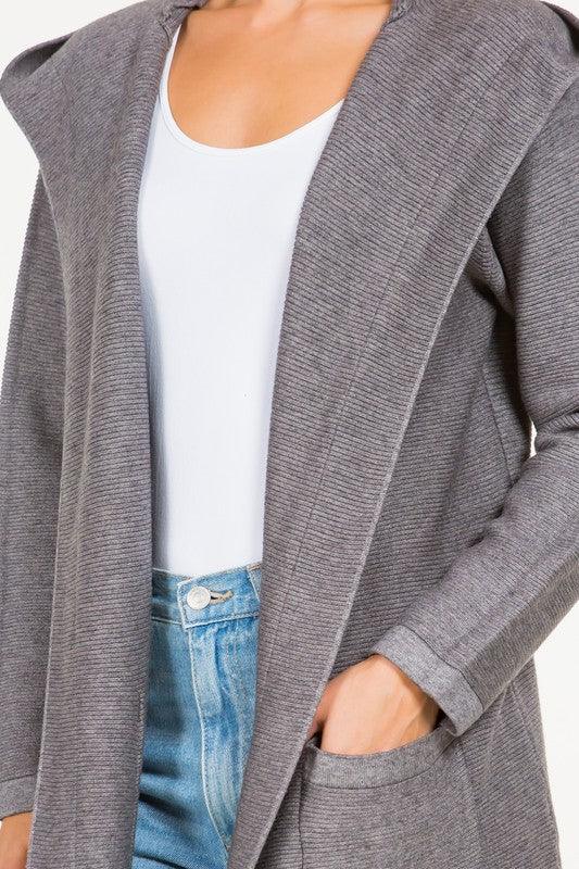 Calvin Cardigan showcasing its classic design and soft fabric, an ideal addition to any wardrobe for warmth and style.