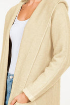 Calvin Cardigan showcasing its classic design and soft fabric, an ideal addition to any wardrobe for warmth and style.