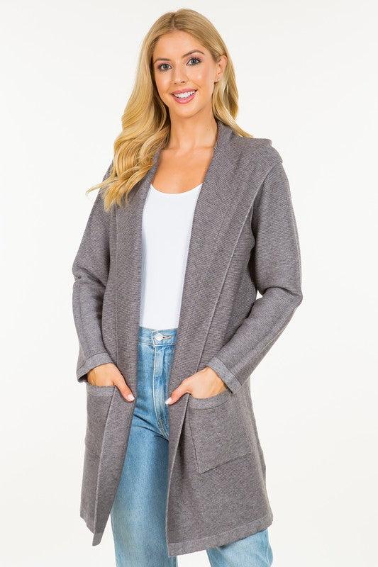 Calvin Cardigan showcasing its classic design and soft fabric, an ideal addition to any wardrobe for warmth and style.
