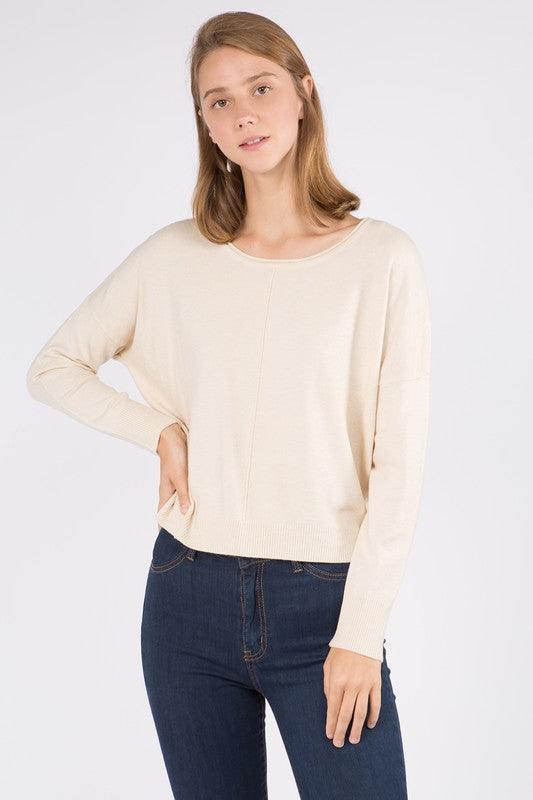 Sarah Sweater showcasing its luxurious fabric blend and versatile design, perfect for a sophisticated and comfortable look.
