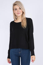 Sarah Sweater showcasing its luxurious fabric blend and versatile design, perfect for a sophisticated and comfortable look.