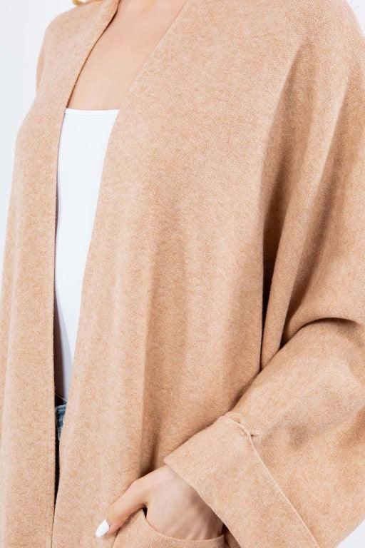 Olivia Cardigan showcasing its open-face design, lightweight knit fabric, and ribbed detailing, ideal for effortless and stylish layering.