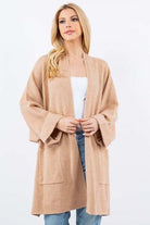Olivia Cardigan showcasing its open-face design, lightweight knit fabric, and ribbed detailing, ideal for effortless and stylish layering.