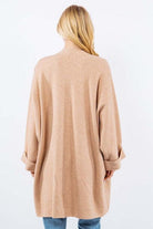 Olivia Cardigan showcasing its open-face design, lightweight knit fabric, and ribbed detailing, ideal for effortless and stylish layering.