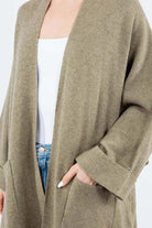 Olivia Cardigan showcasing its open-face design, lightweight knit fabric, and ribbed detailing, ideal for effortless and stylish layering.