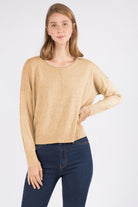 Sarah Sweater showcasing its luxurious fabric blend and versatile design, perfect for a sophisticated and comfortable look.
