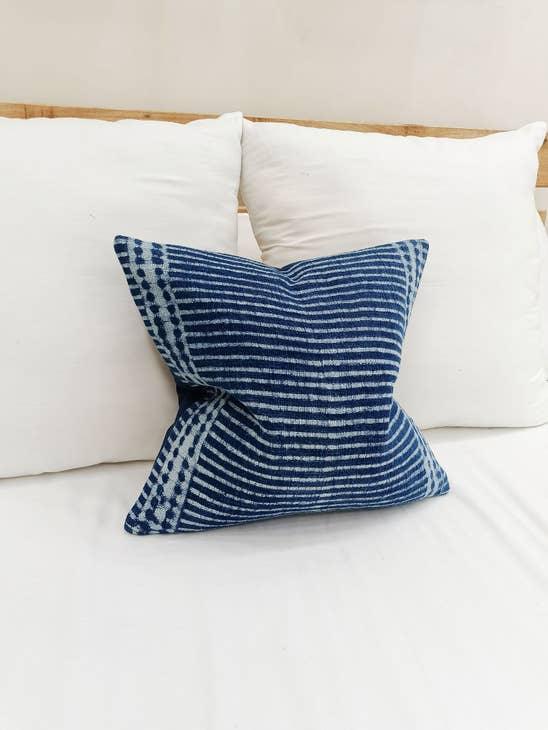 Image of the 'Indigo Blue Square Pillow Cover', showcasing its vibrant indigo color and fine cotton material, designed by Indian master artisans.