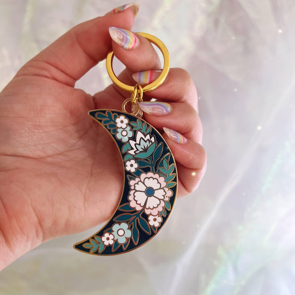 Botanical Moon Enamel Keychain, showcasing the beautiful combination of the moon and botanical elements in a detailed design.