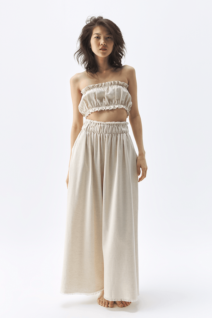 Natural Palazzo Pants - Breezy wide-leg silhouette in a versatile natural hue. Comfortable and chic for any occasion. Elevate your style with these palazzo pants.