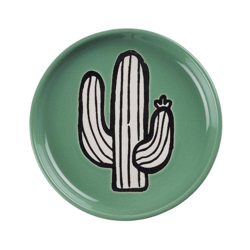 A vibrant and unique cactus-shaped coaster on a table.
