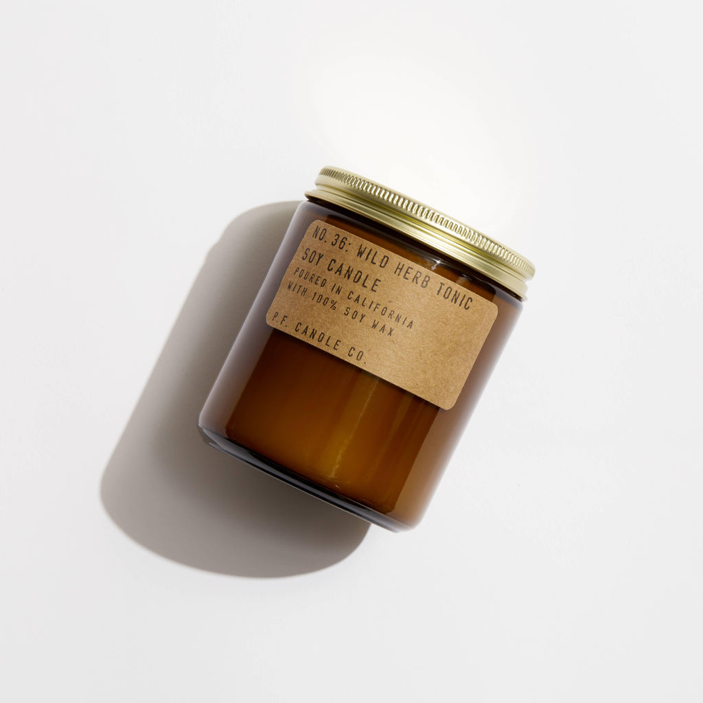P.F. Candle Wild Herb Tonic Soy Candle - Hand-poured soy wax candle in a glass jar.
