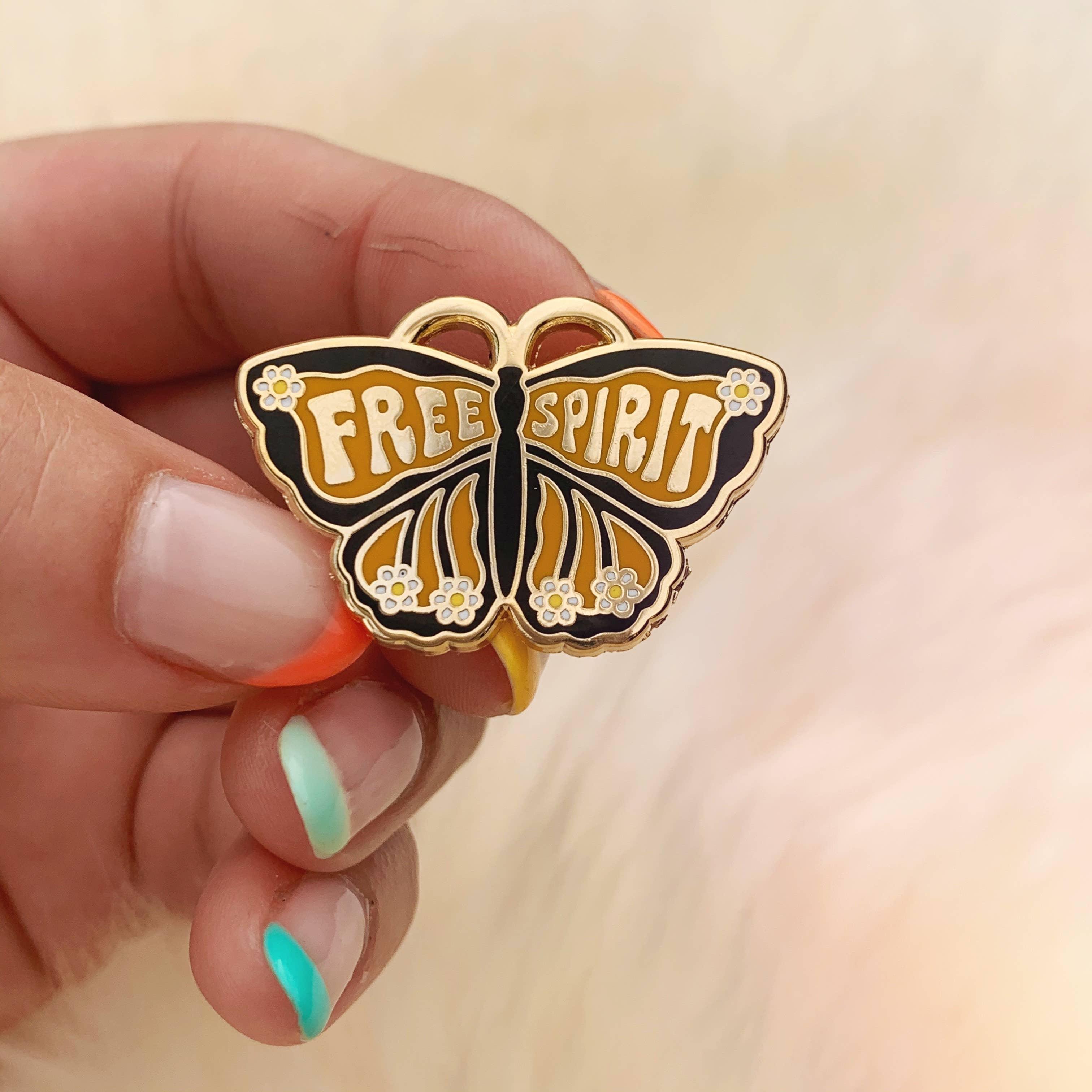 Free Spirit Butterfly Enamel Pin, featuring a detailed, radiant butterfly design, signifying transformation and unbridled freedom.