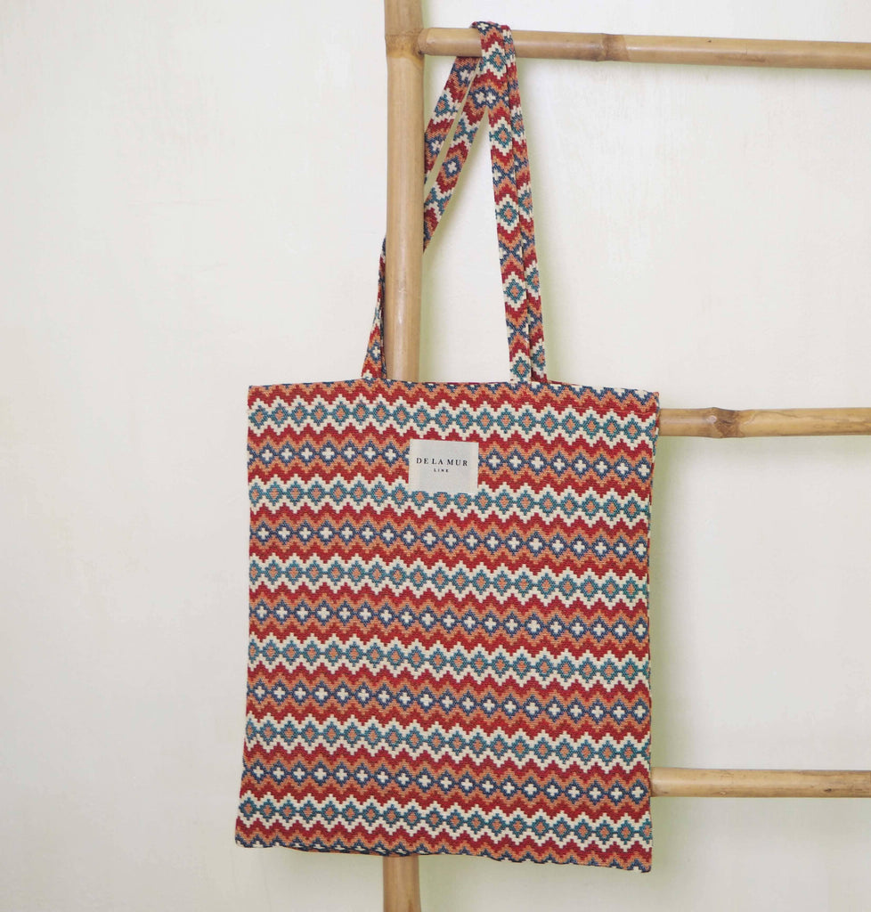 Porto Tote Small constructed from durable materials, boasting a chic design with the perfect blend of space