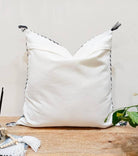 Image showcasing the 'Blue Embroidered Pillow Cover', meticulously crafted from 100% organic cotton and natural fibers, highlighting its intriguing design.